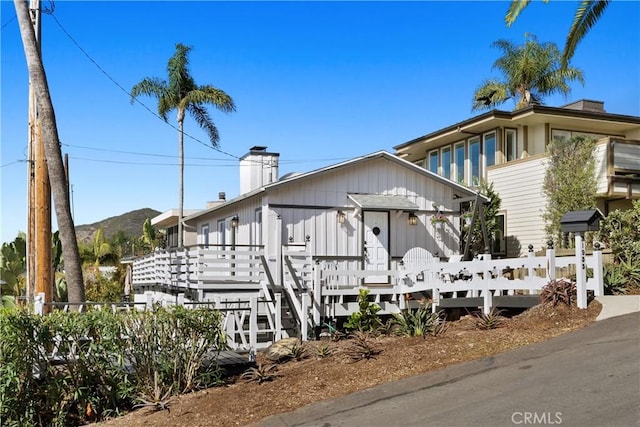 view of front of home with a mountain view