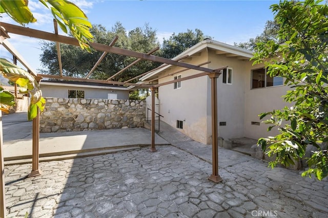 view of patio / terrace featuring fence