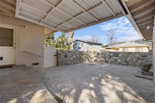 view of patio / terrace with a gate and fence