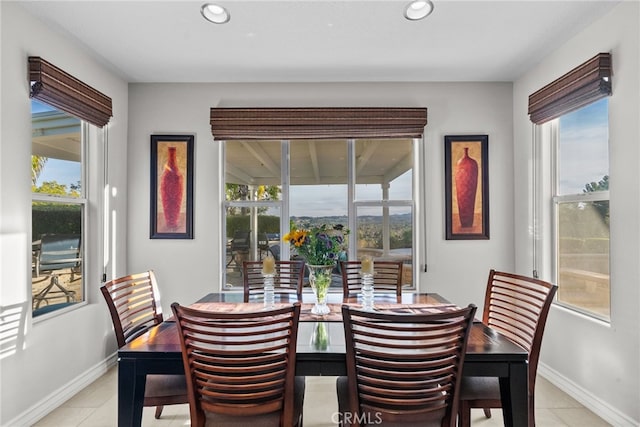 dining area with a healthy amount of sunlight and light tile patterned floors