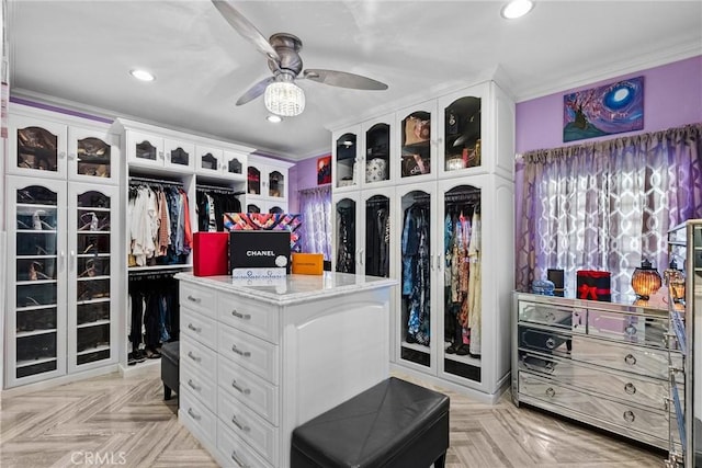 spacious closet with ceiling fan and light parquet floors