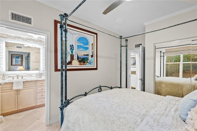 bedroom featuring crown molding, sink, ensuite bathroom, and ceiling fan