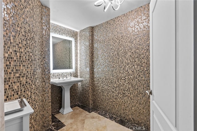 bathroom featuring tile walls, sink, and tile patterned floors