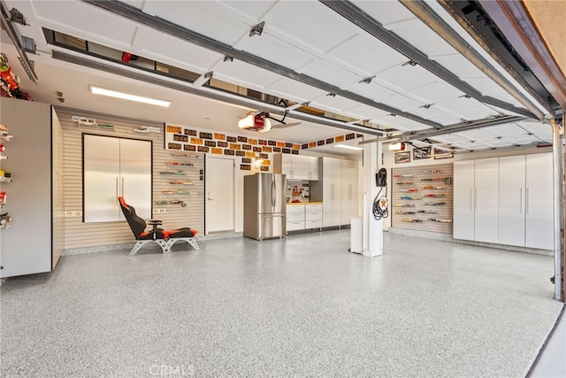 garage featuring stainless steel fridge