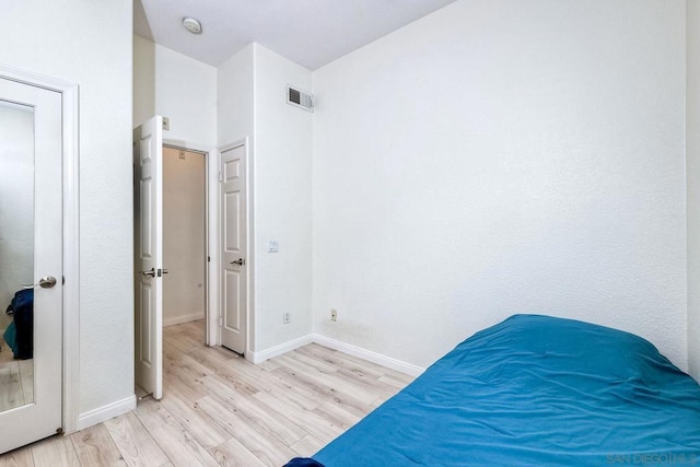 bedroom featuring light wood-type flooring