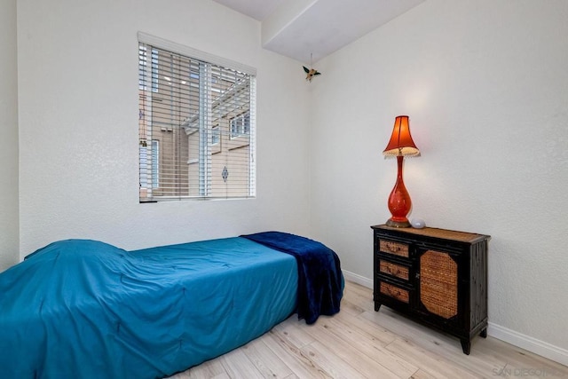 bedroom featuring wood-type flooring