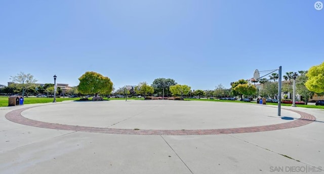 view of property's community featuring basketball hoop