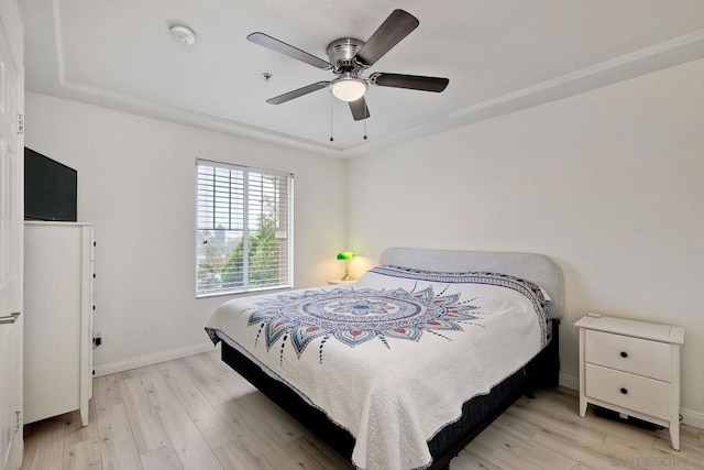 bedroom featuring ceiling fan and light hardwood / wood-style floors