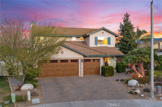 view of front of property with a garage