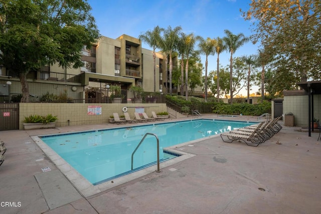 view of swimming pool featuring a patio area