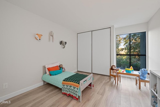 bedroom with light hardwood / wood-style floors