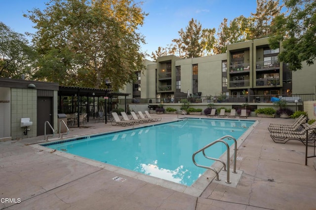 view of swimming pool featuring a patio area