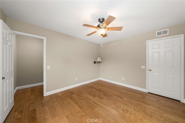 unfurnished bedroom with hardwood / wood-style floors and ceiling fan