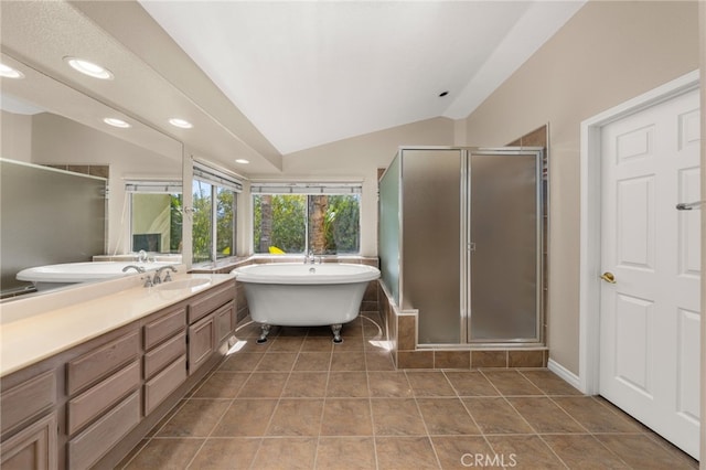 bathroom featuring lofted ceiling, vanity, tile patterned floors, and shower with separate bathtub