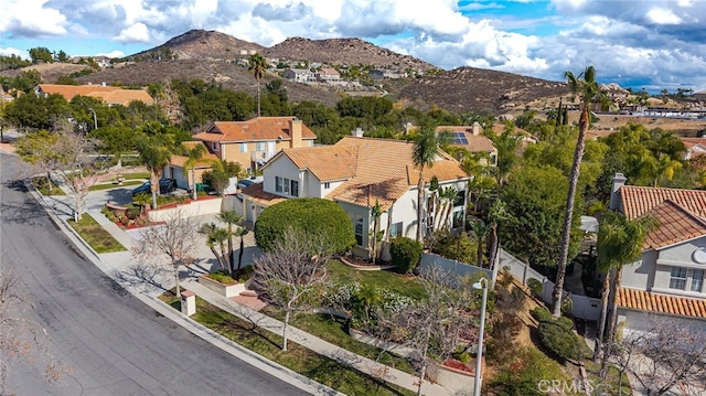 birds eye view of property featuring a mountain view