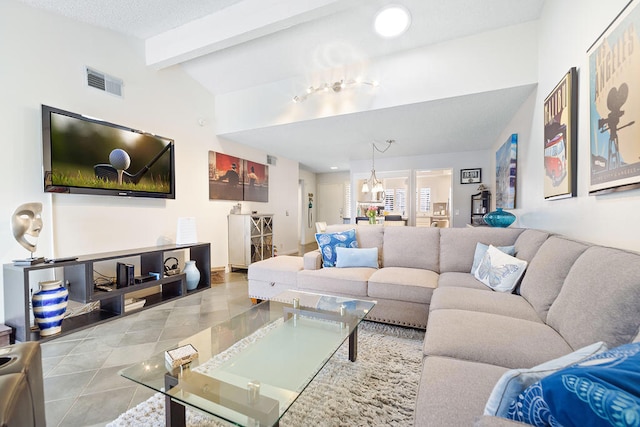 living room featuring an inviting chandelier, lofted ceiling with beams, and light tile patterned floors