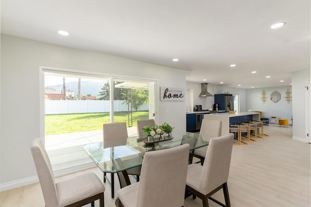 dining room with light wood-type flooring