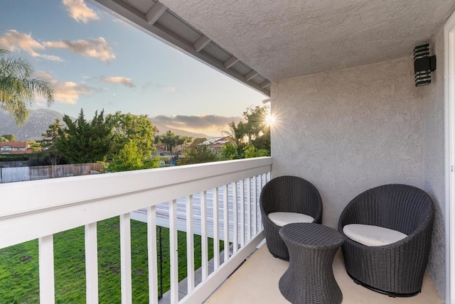 view of balcony at dusk