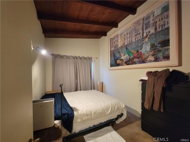 bedroom featuring beam ceiling and wood ceiling