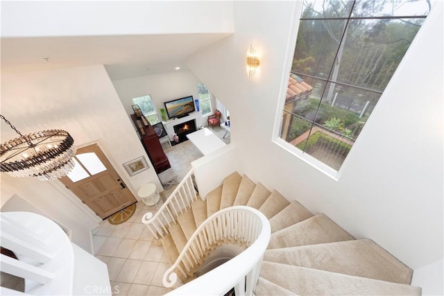 stairway featuring tile patterned flooring