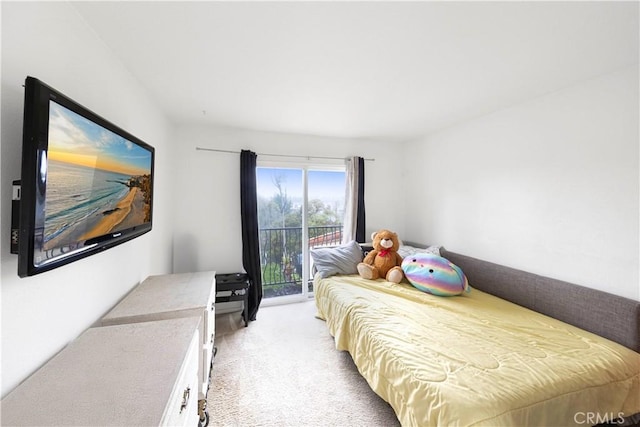 carpeted bedroom featuring access to outside