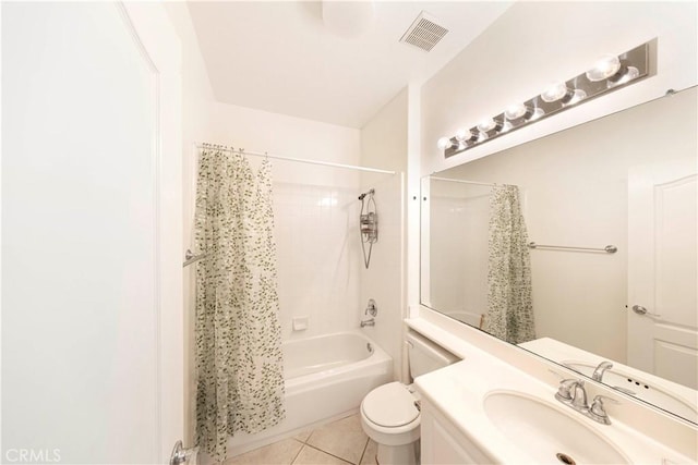 full bathroom featuring tile patterned floors, toilet, vanity, and shower / bath combo