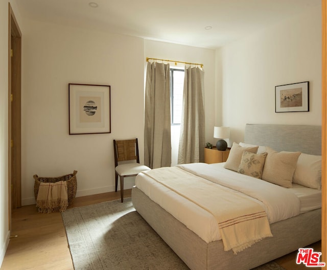 bedroom with light wood-type flooring