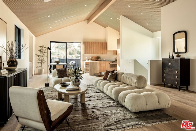 living room with beam ceiling, high vaulted ceiling, and light hardwood / wood-style flooring