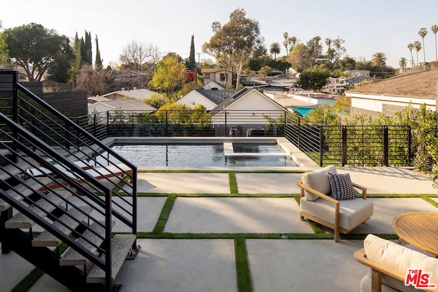 view of pool featuring a patio area