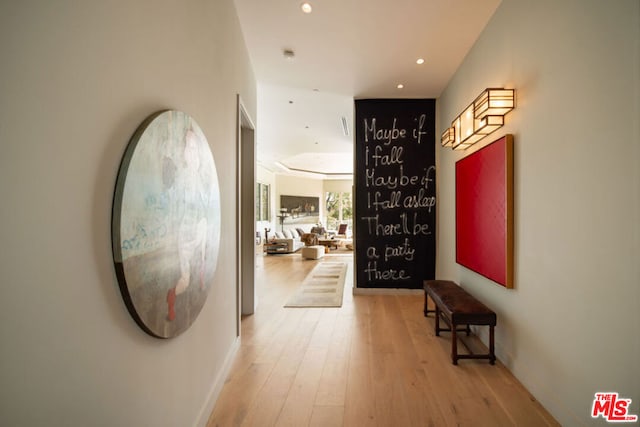 hall with light hardwood / wood-style floors