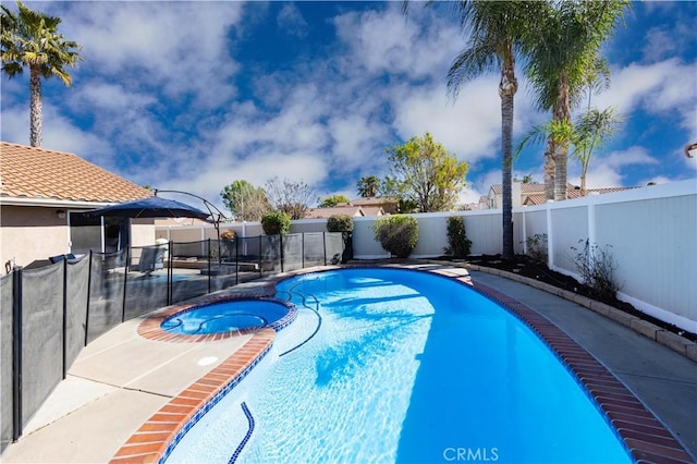 view of pool with an in ground hot tub