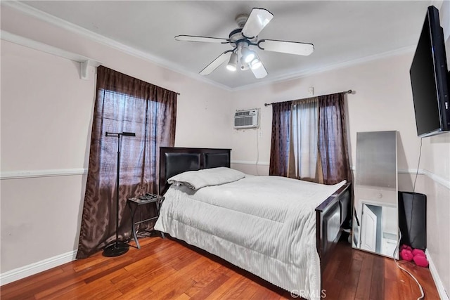 bedroom featuring crown molding, a wall mounted air conditioner, hardwood / wood-style flooring, and ceiling fan