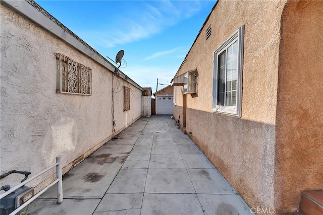 view of side of home with a garage