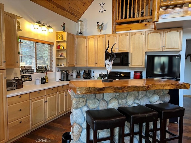 kitchen featuring range with electric cooktop, wood counters, a kitchen breakfast bar, dark hardwood / wood-style flooring, and light brown cabinets