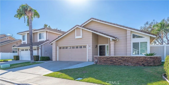 view of front of house featuring a garage and a front yard