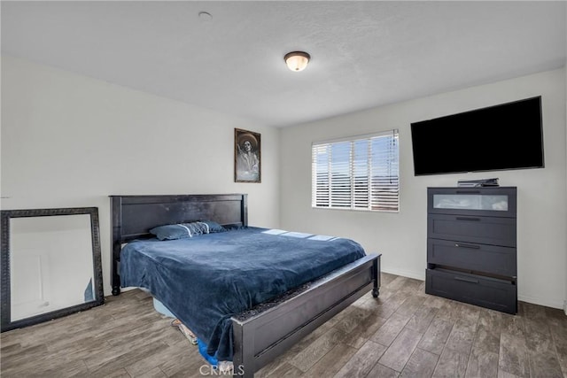 bedroom featuring hardwood / wood-style flooring