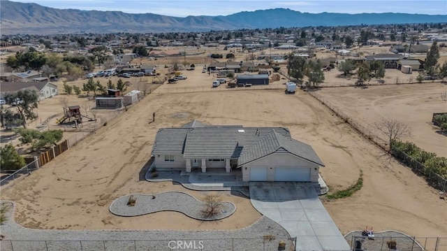 drone / aerial view featuring a mountain view