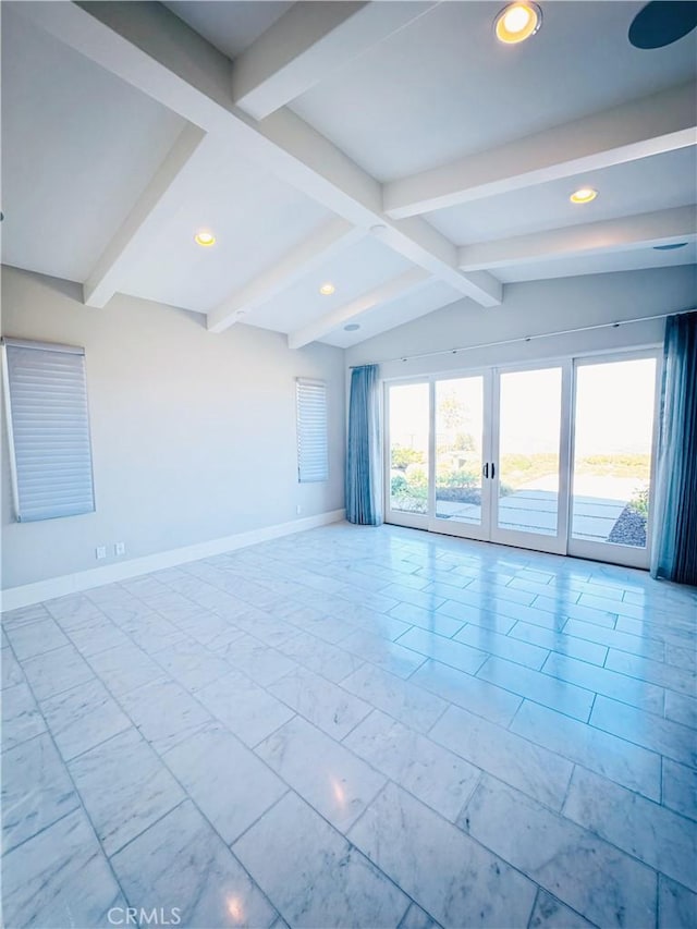 unfurnished room with lofted ceiling with beams and french doors