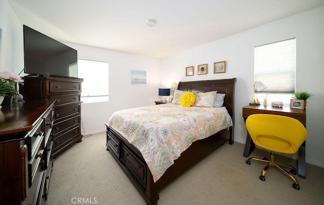 bedroom with light carpet