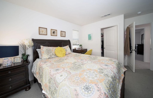 bedroom with light carpet and a closet