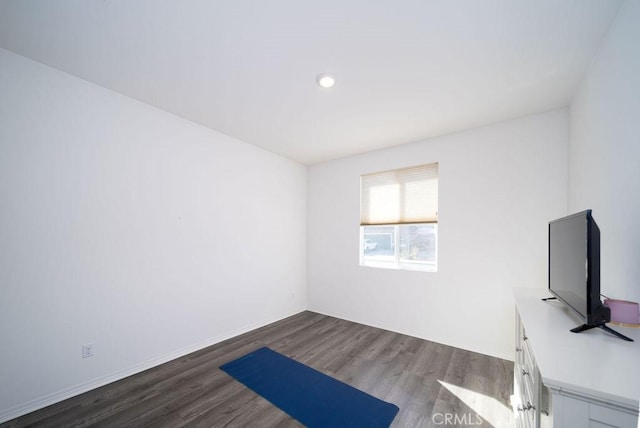 unfurnished office featuring dark wood-type flooring