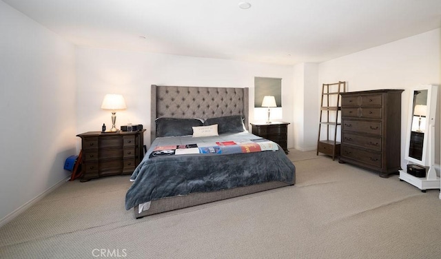 bedroom featuring light colored carpet