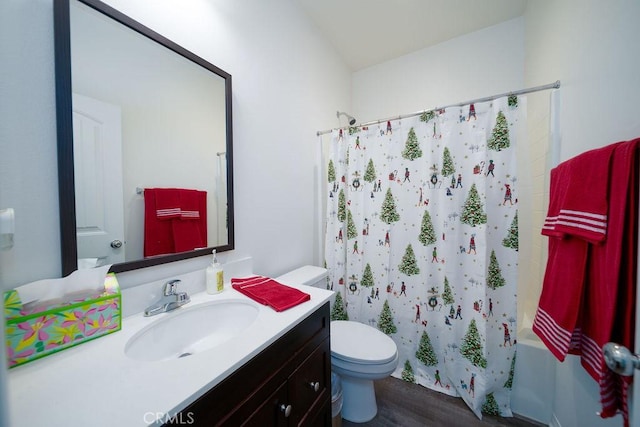 full bathroom with vanity, toilet, hardwood / wood-style floors, and shower / bath combo with shower curtain