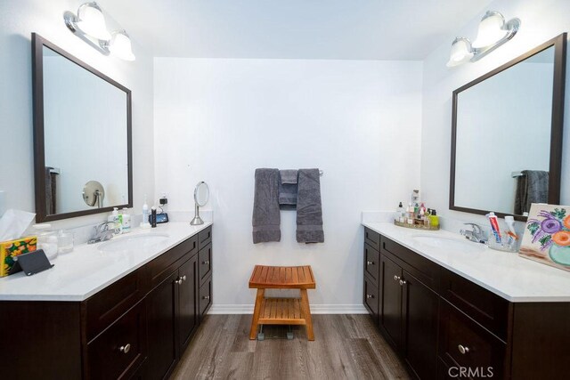 bathroom with vanity and hardwood / wood-style floors