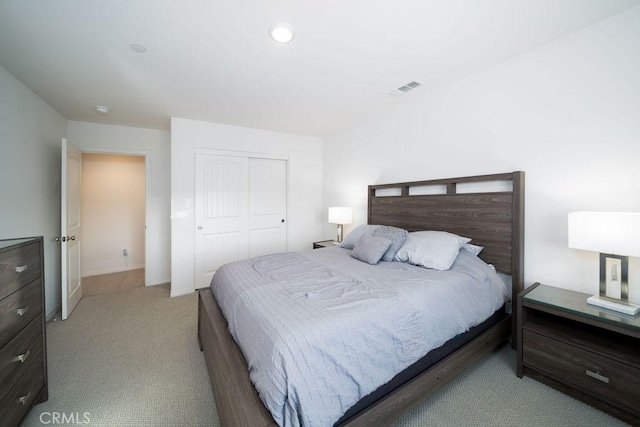 carpeted bedroom featuring a closet