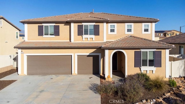 mediterranean / spanish-style house featuring a garage