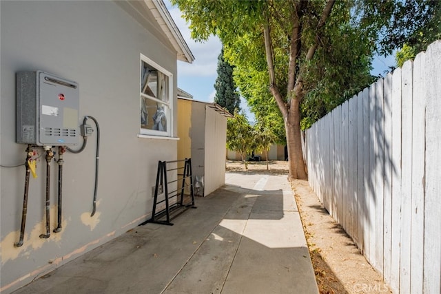 view of side of property with a patio area