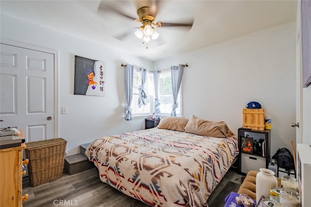 bedroom featuring dark hardwood / wood-style floors and ceiling fan