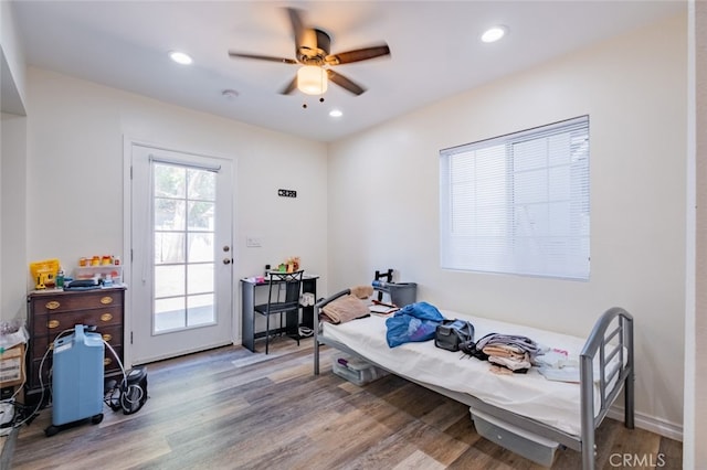 bedroom featuring hardwood / wood-style floors and ceiling fan