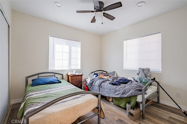 bedroom with hardwood / wood-style flooring and ceiling fan